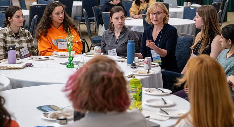 CEMS students meeting industry professionals over dinner