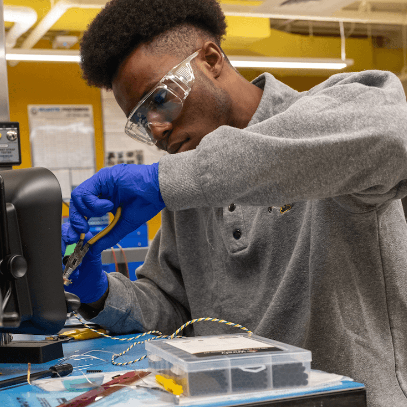 An engineering student works on a project