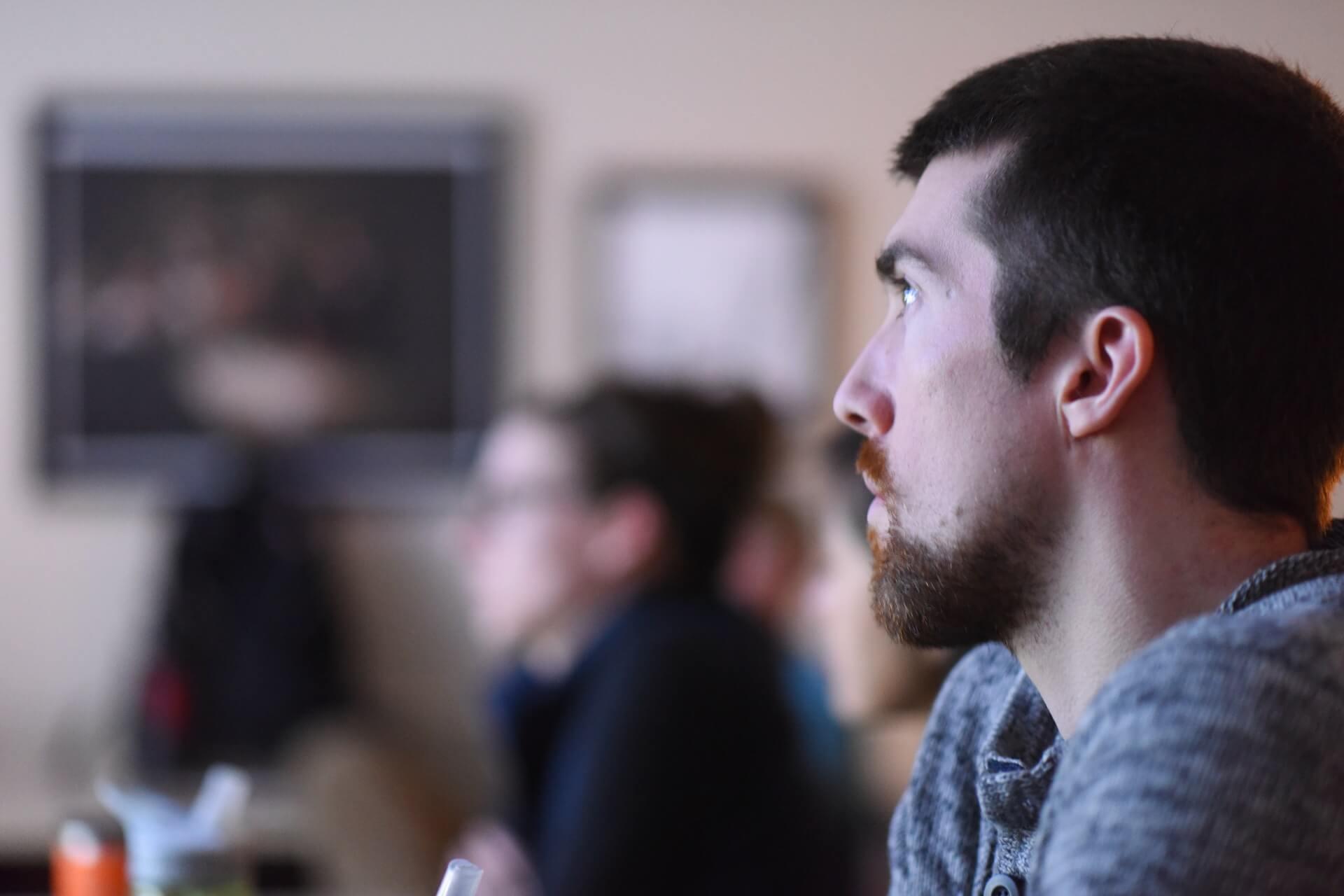 Person listening intently to presenation