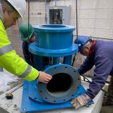 engineer installing a large pump