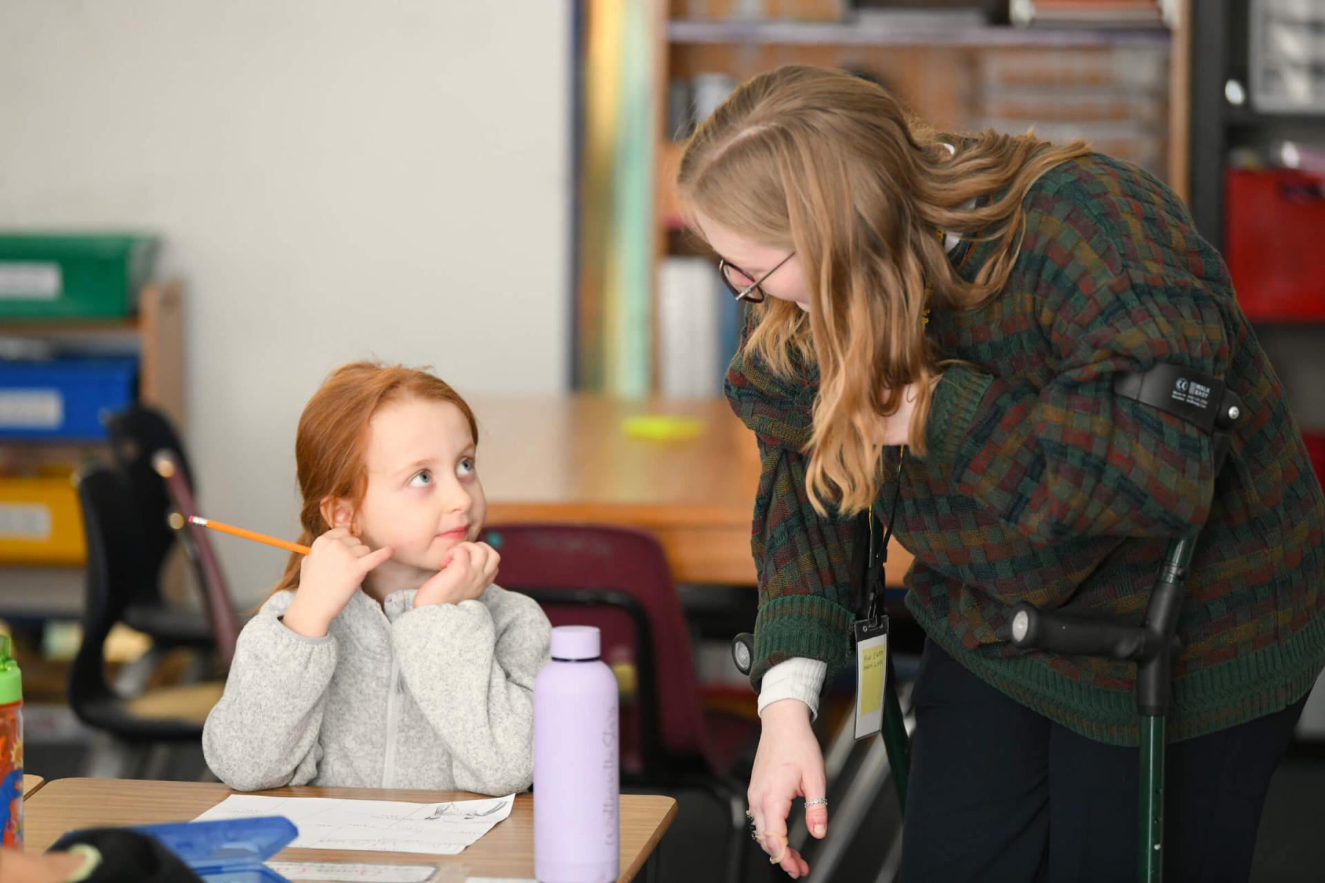 Charlie Meecham teaching a student during her internship at Allen Brook School..