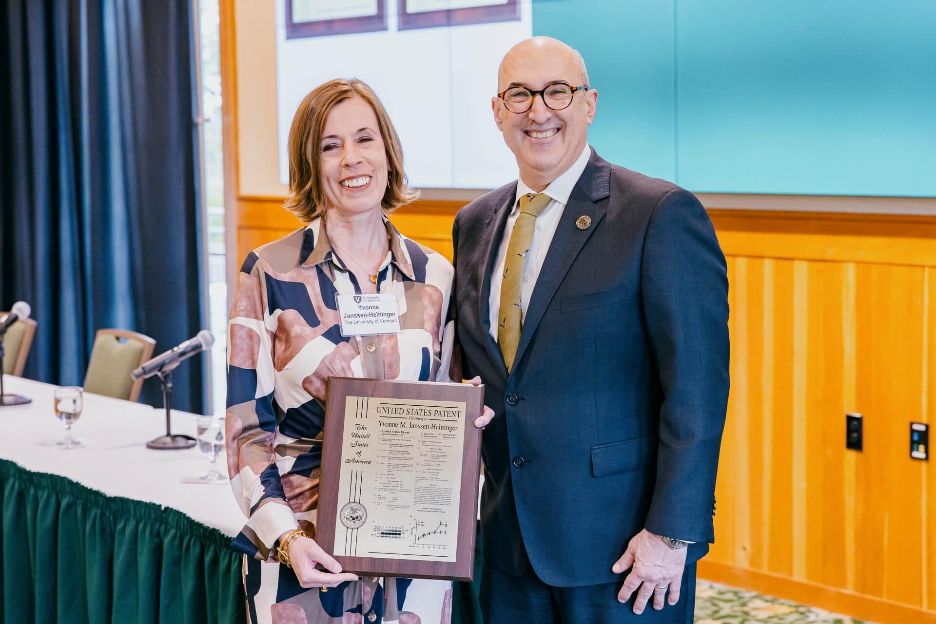 Vice President Kirk Dombrowski stands with Yvonne Janssen-Heininger, Ph.D