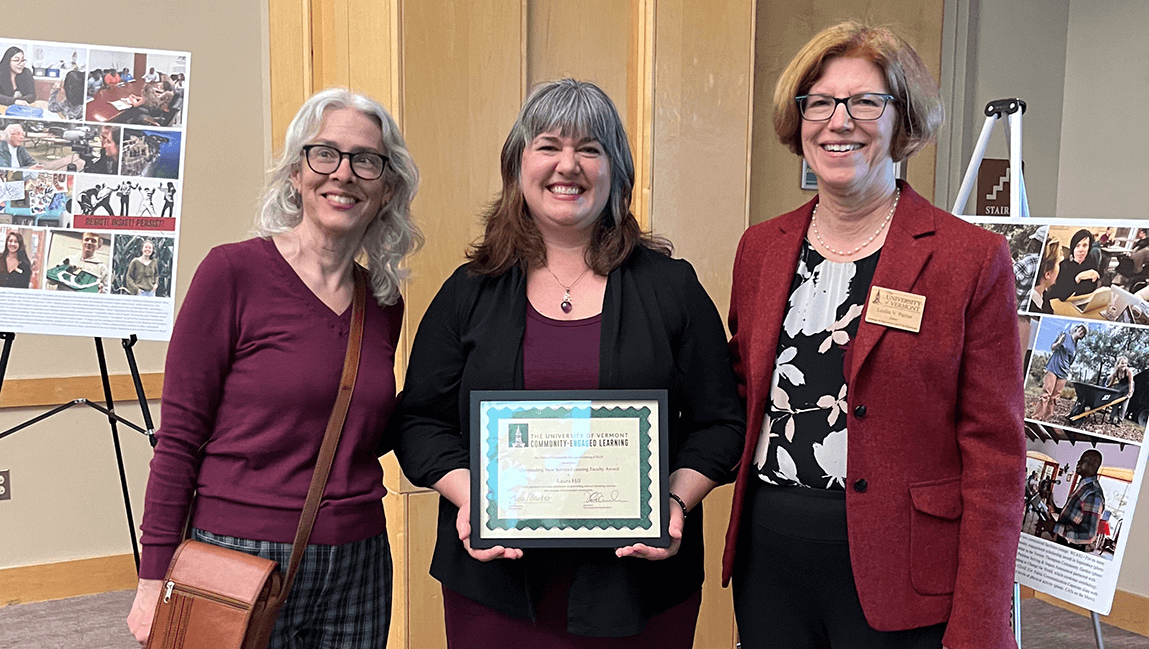 Department Chair and College Dean flank CELO Award recipient Laura Hill at Awards Ceremony