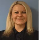 A blonde woman wearing a black shirt