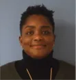 A woman wearing a black turtleneck