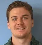 A man wearing a green shirt