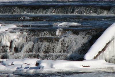Icy water flowing in river in winter
