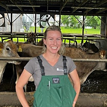 Whitney Hull with a lot of cows