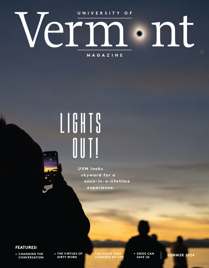 cover of the fall 2024 issue of UVM Magazine featuring someone taking a picture of the solar eclipse at sunset
